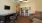 a living room with a table and chairs